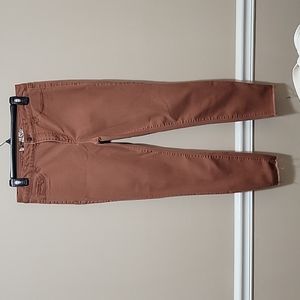 Rewash rustic orange jeans with distressed ankle detailing